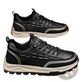 Men’s black crocodile embossed leather sneakers with beige rubber sole and silver accent stripes