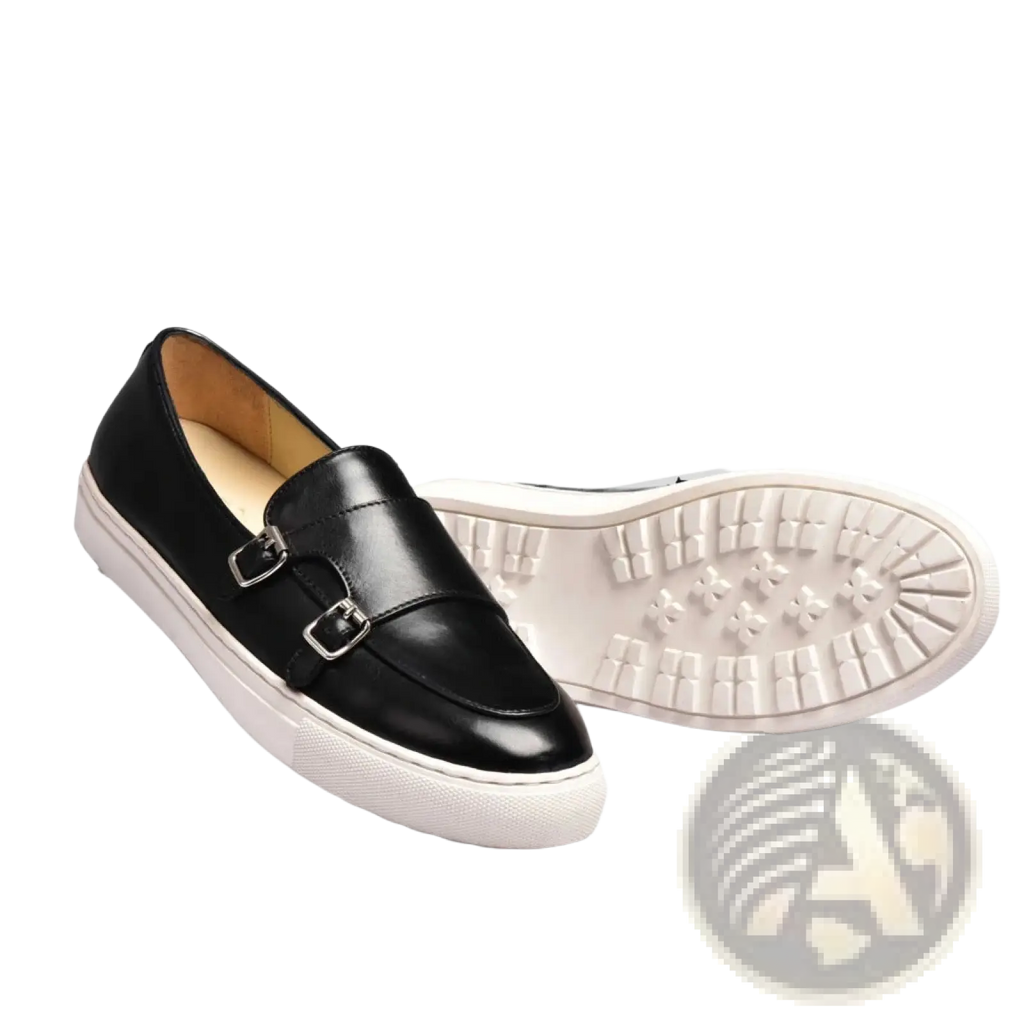 Men’s black leather slip-on loafers featuring silver buckle detailing and a white rubber sole for casual wear