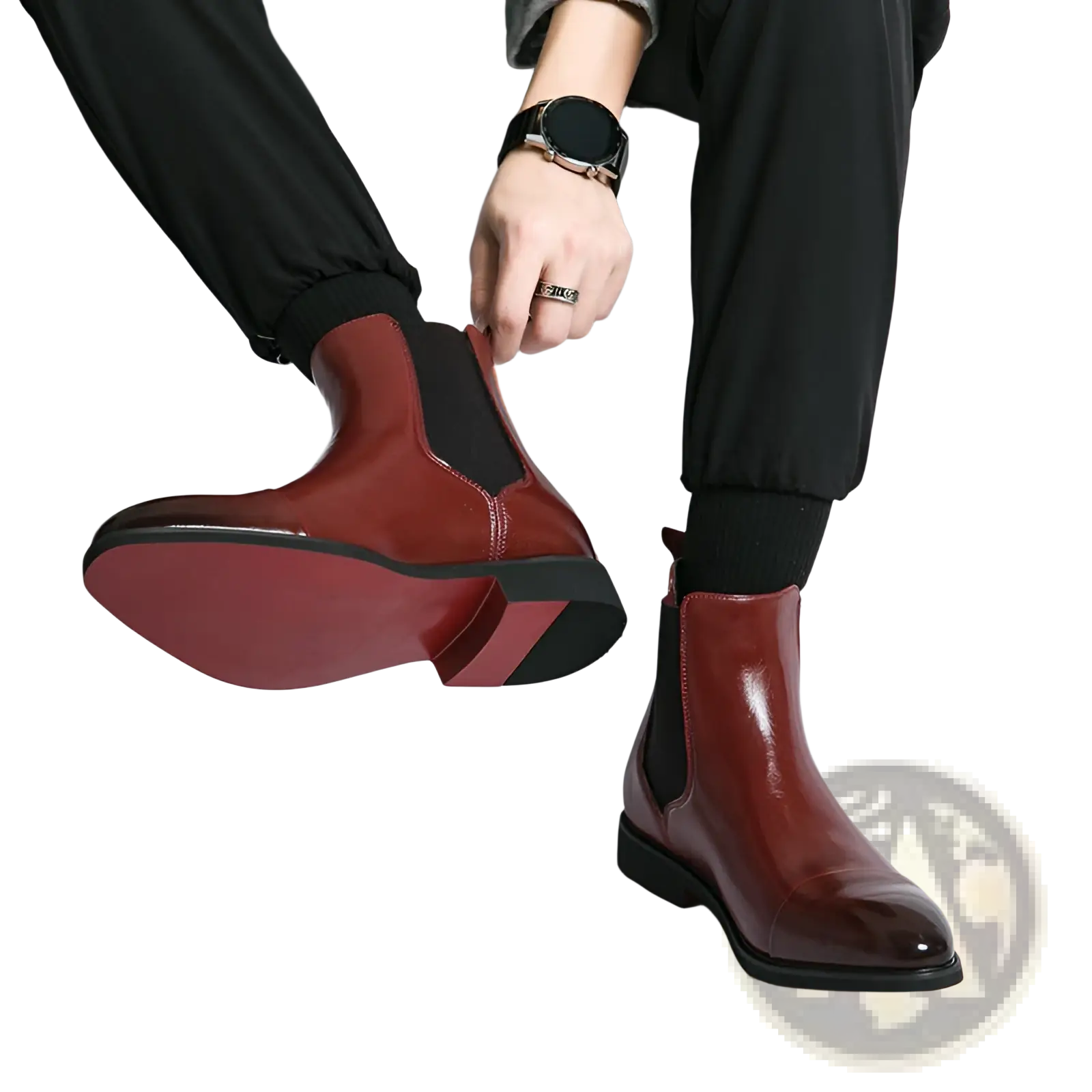Men’s burgundy leather chelsea boots with black rubber soles and elastic side panels for sleek formal wear