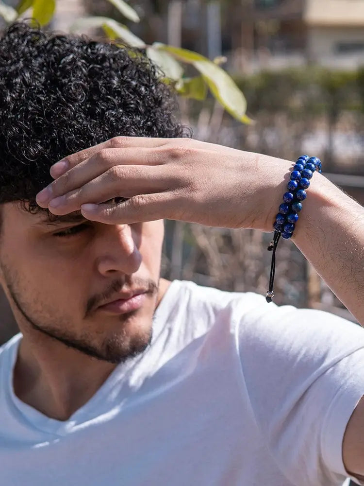 Men’s Morocco Blue lapis lazuli beaded bracelet with deep blue beads, black cord, and silver toned clasp