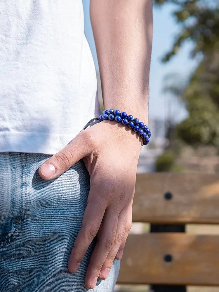 Men’s morocco blue lapis lazuli beaded bracelet featuring deep blue lapis lazuli beads worn on a wrist