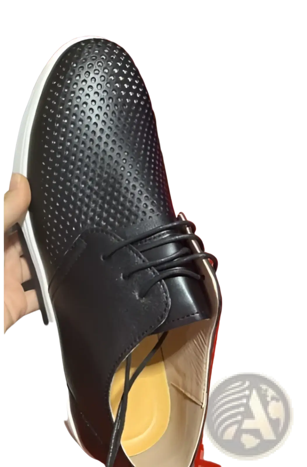 Black breathable perforated leather men’s sneakers with lace-up design and white non-slip rubber sole