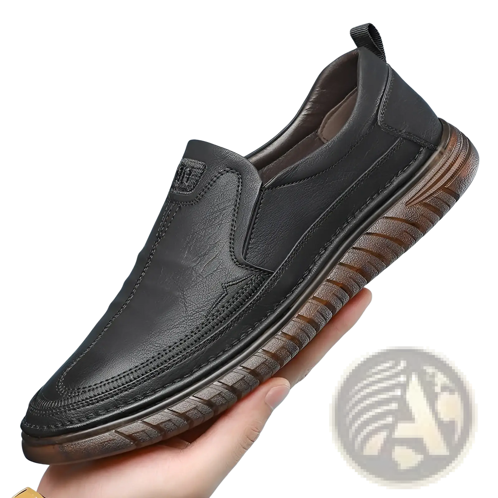 Black leather slip-on men’s breathable non slip PU leather loafers with brown textured rubber sole shown from the back