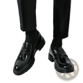 Men’s breathable black patent leather tassel loafers with chunky sole and brogue detailing