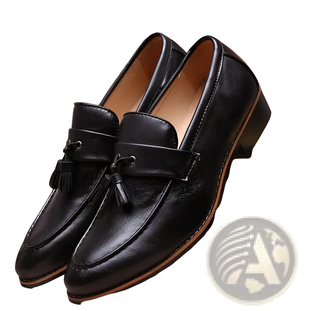 Black leather tassel loafers with a polished finish and contrasting tan soles.