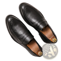Black leather slip-on loafers with visible stitching in men’s British style microfiber suede and leather loafers design