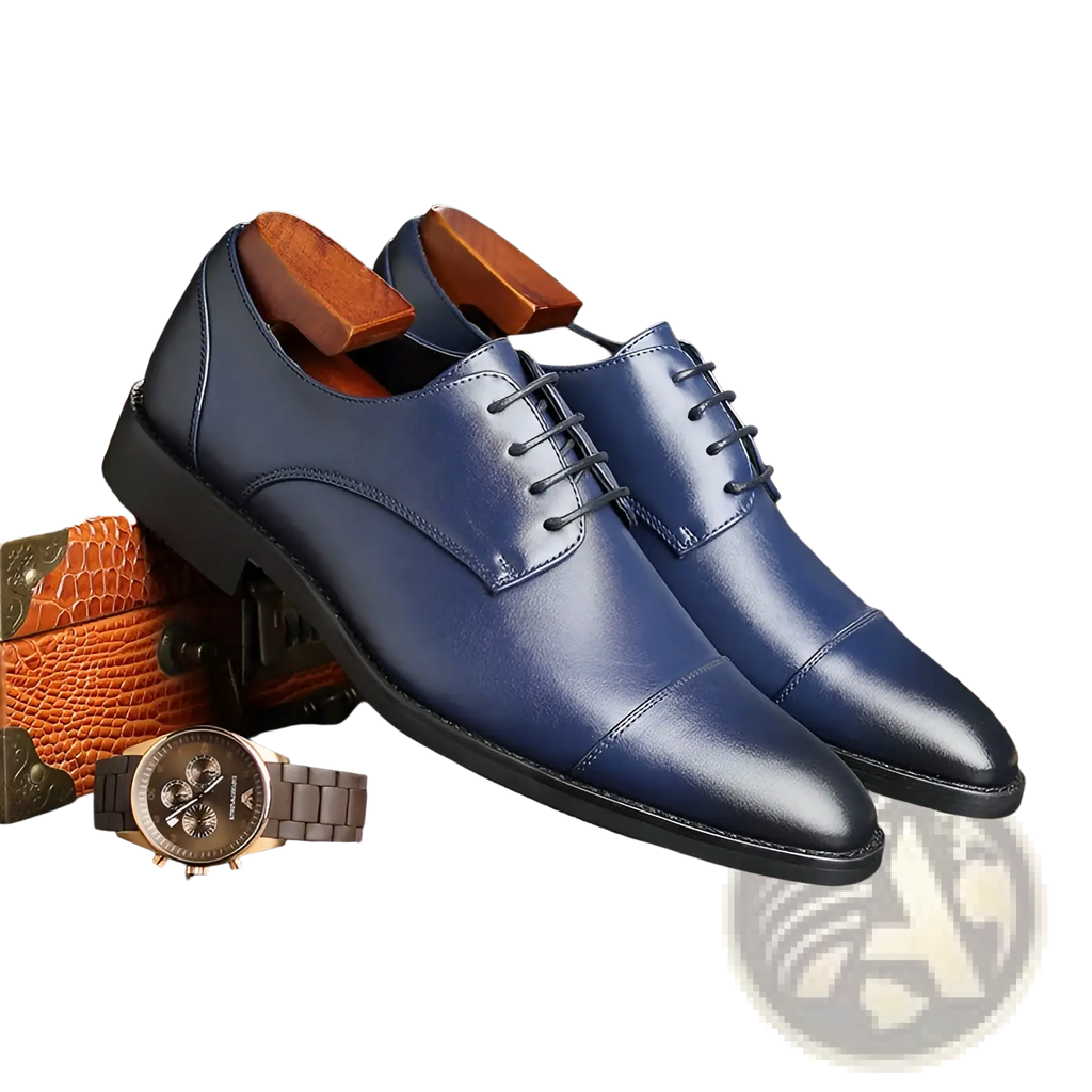 A pair of men’s British style navy blue faux leather dress shoes with pointed toes and polished wooden insoles