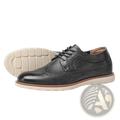 Men’s brogue casual leather sneakers in black with perforated detailing and cream rubber sole for lightweight wear