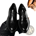 Men’s black leather brogue oxford shoes with perforated detailing polished finish and chunky sole for business casual wear