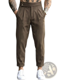 Men’s brown pleated tapered suit pants with tailored fit and rolled cuffs in a formal style
