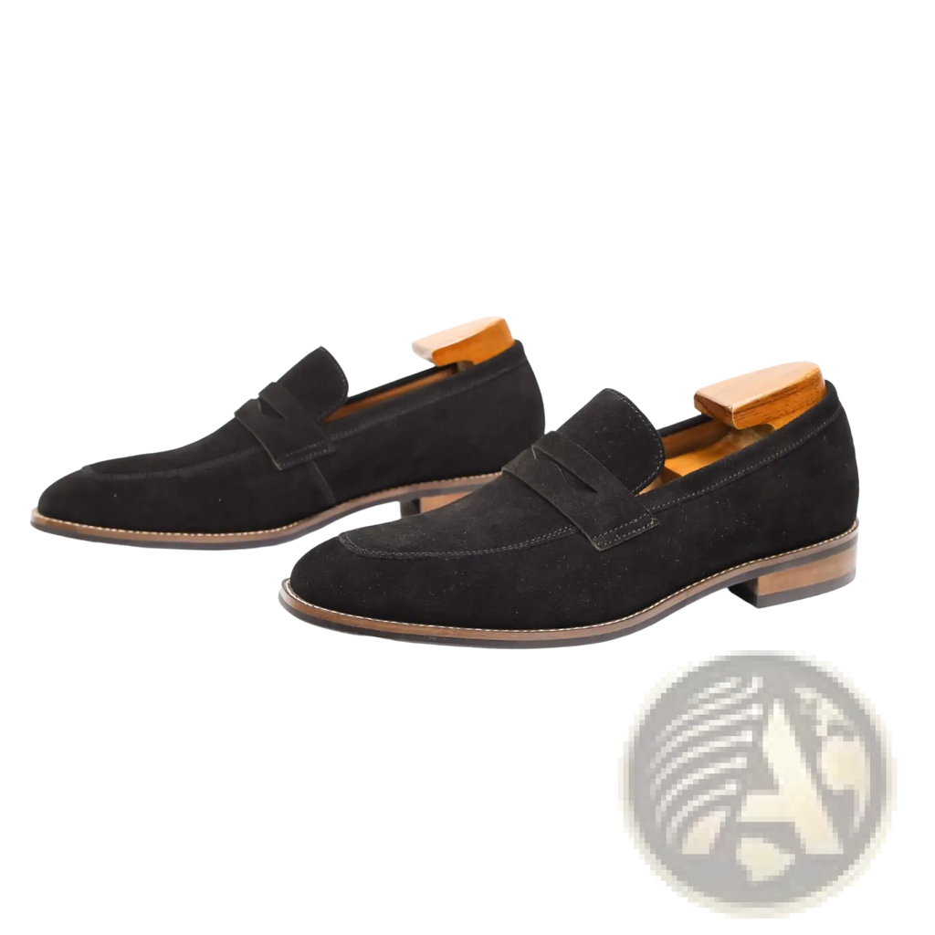 Men’s black suede loafers with classic slip-on design and contrasting tan leather soles for casual wear