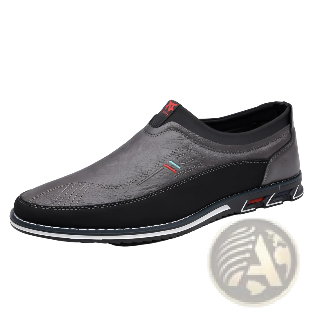 Men’s business casual leather slip-on loafers in gray and black with textured upper, contrasting stitching, and red-accented sole