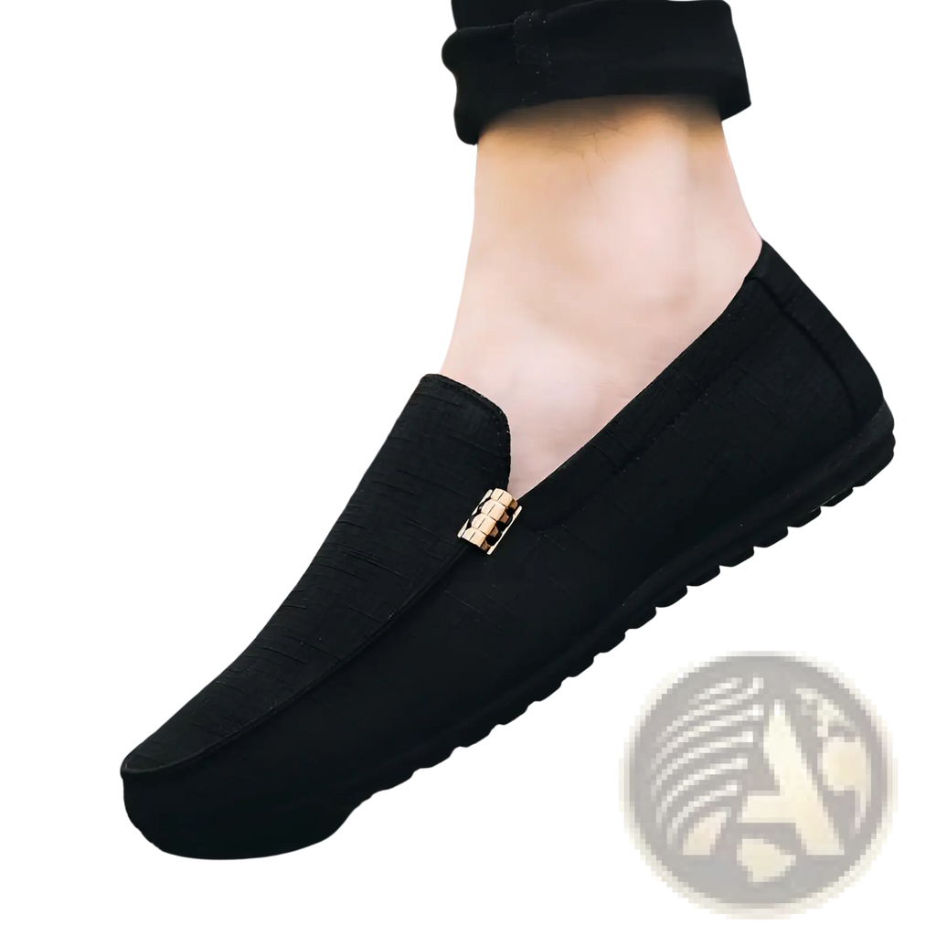 Men’s black canvas slip-on loafers with a gold-tone rectangular buckle detail for casual and formal wear