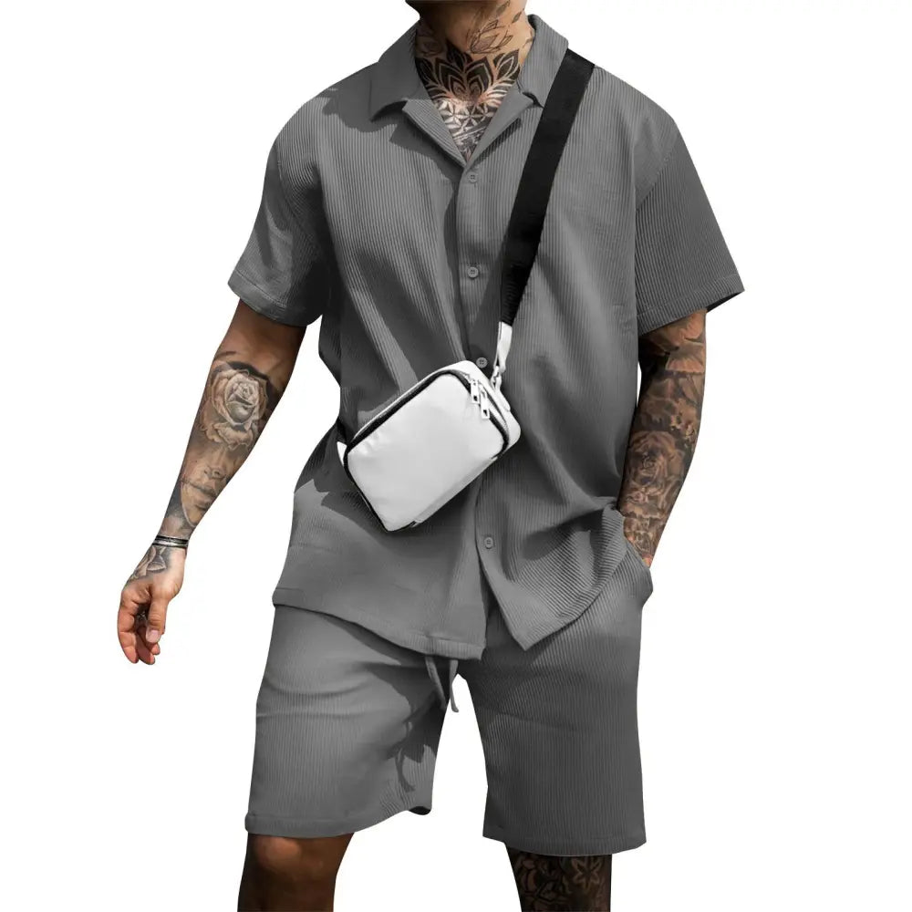 White crossbody bag with black strap paired with men’s casual cotton polo and shorts matching summer set