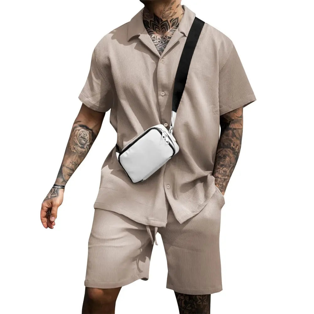 White crossbody bag with black strap and zipper closure paired with mens casual cotton polo and shorts summer set