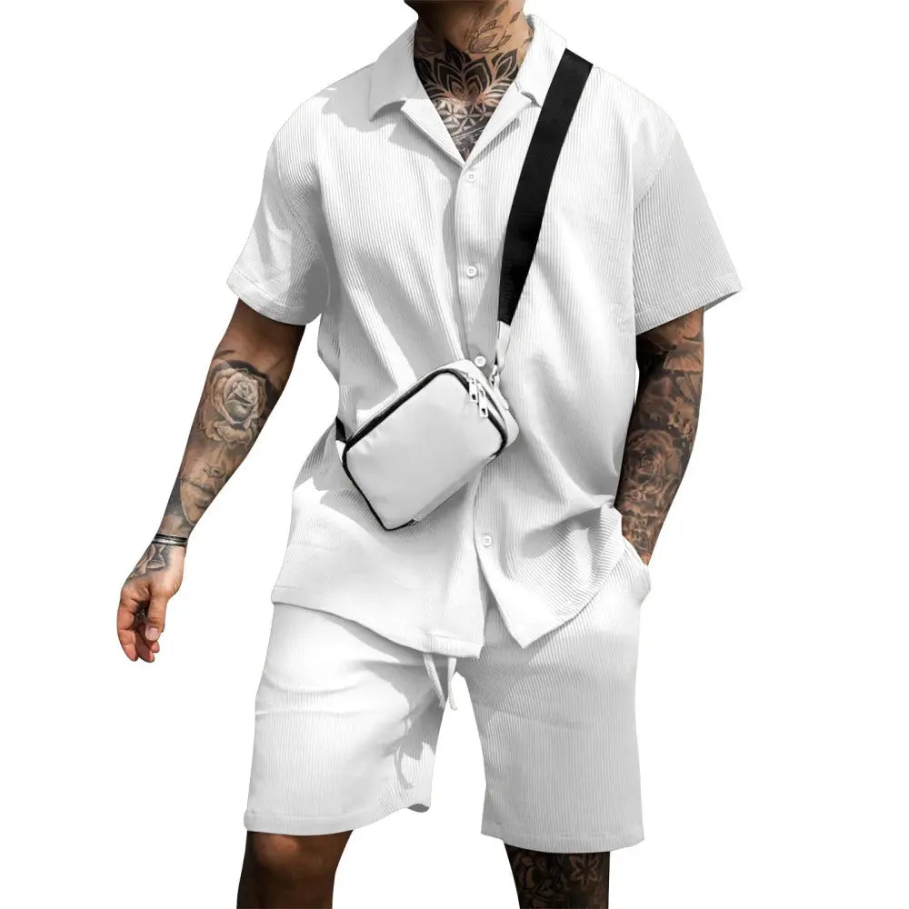 White crossbody bag with black strap and zipper closure paired with mens casual cotton polo and shorts summer set