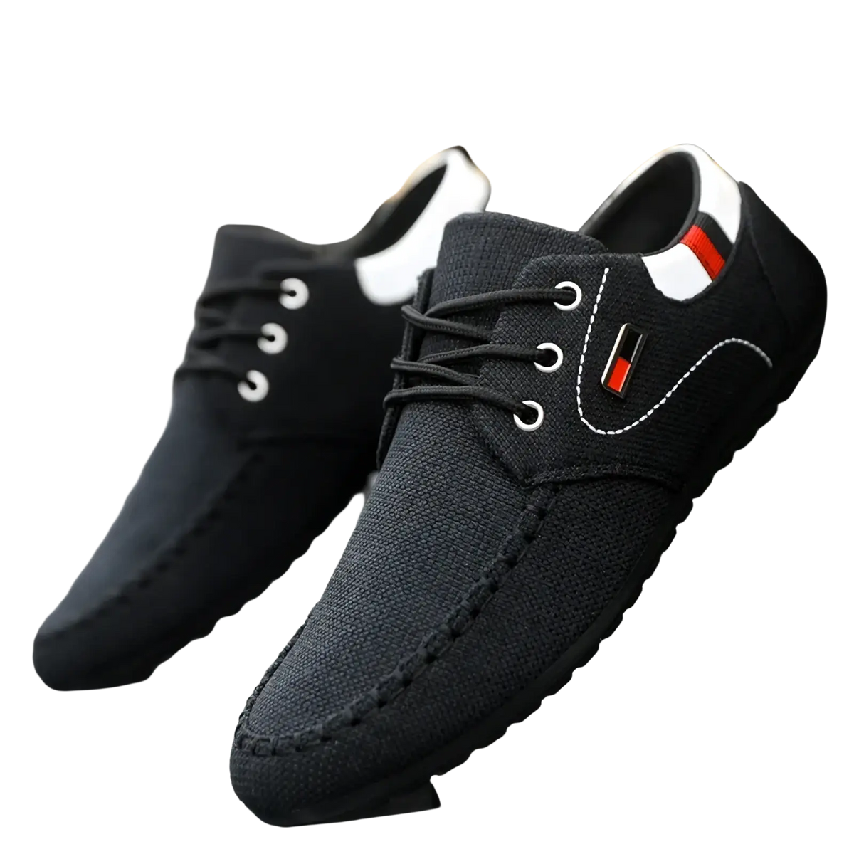 Men’s casual black canvas sneakers with white stitching, red and black logo patch, and white collar accents