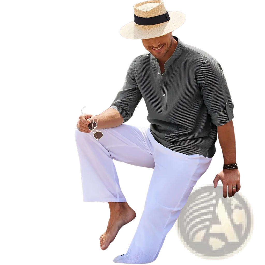 Man wearing a dark green striped ribbed cotton blend stand collar shirt paired with white trousers and a straw hat