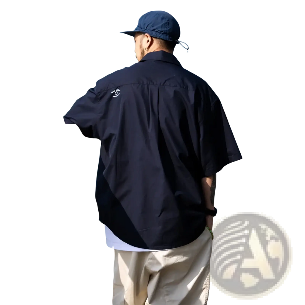 Mens casual short sleeve button up shirt in dark navy showing the back side with a subtle embroidered logo on collar