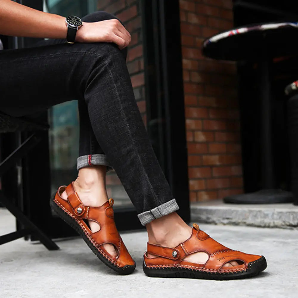 Men’s brown woven leather closed toe beach sandals with stitched design and black rubber soles