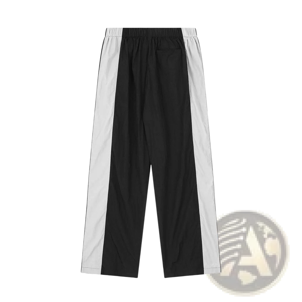 Men’s black and white contrast panel elastic waist denim joggers with side stripes and an adjustable waistband