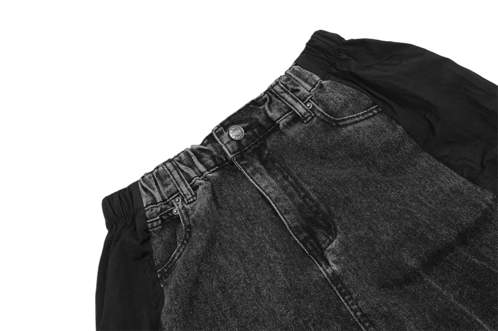 Men’s dark-wash denim joggers with elastic waistband and black contrast fabric panel on the side