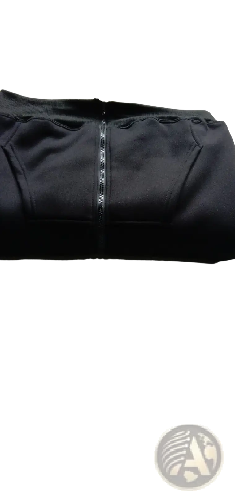 Men’s black zippered pants with smooth stretchy fabric and subtle seam detailing complementing a cotton blend zip up pocket hoodie
