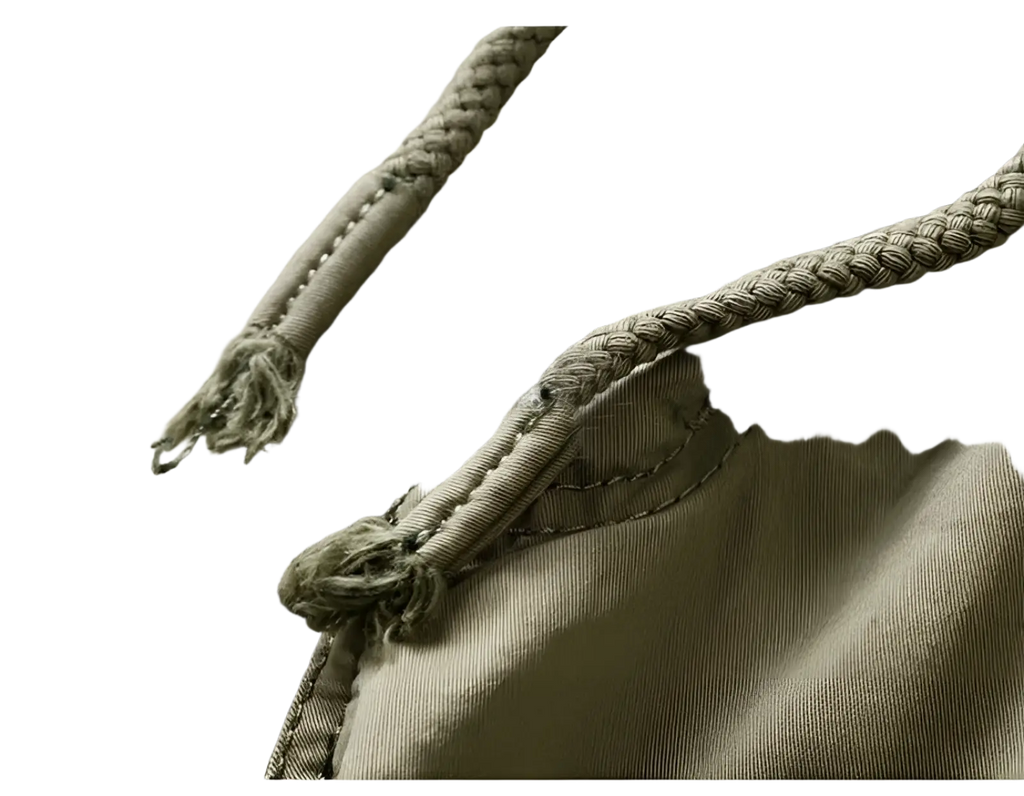 Beige braided cotton drawstring with frayed ends on men’s relaxed fit cotton cargo shorts