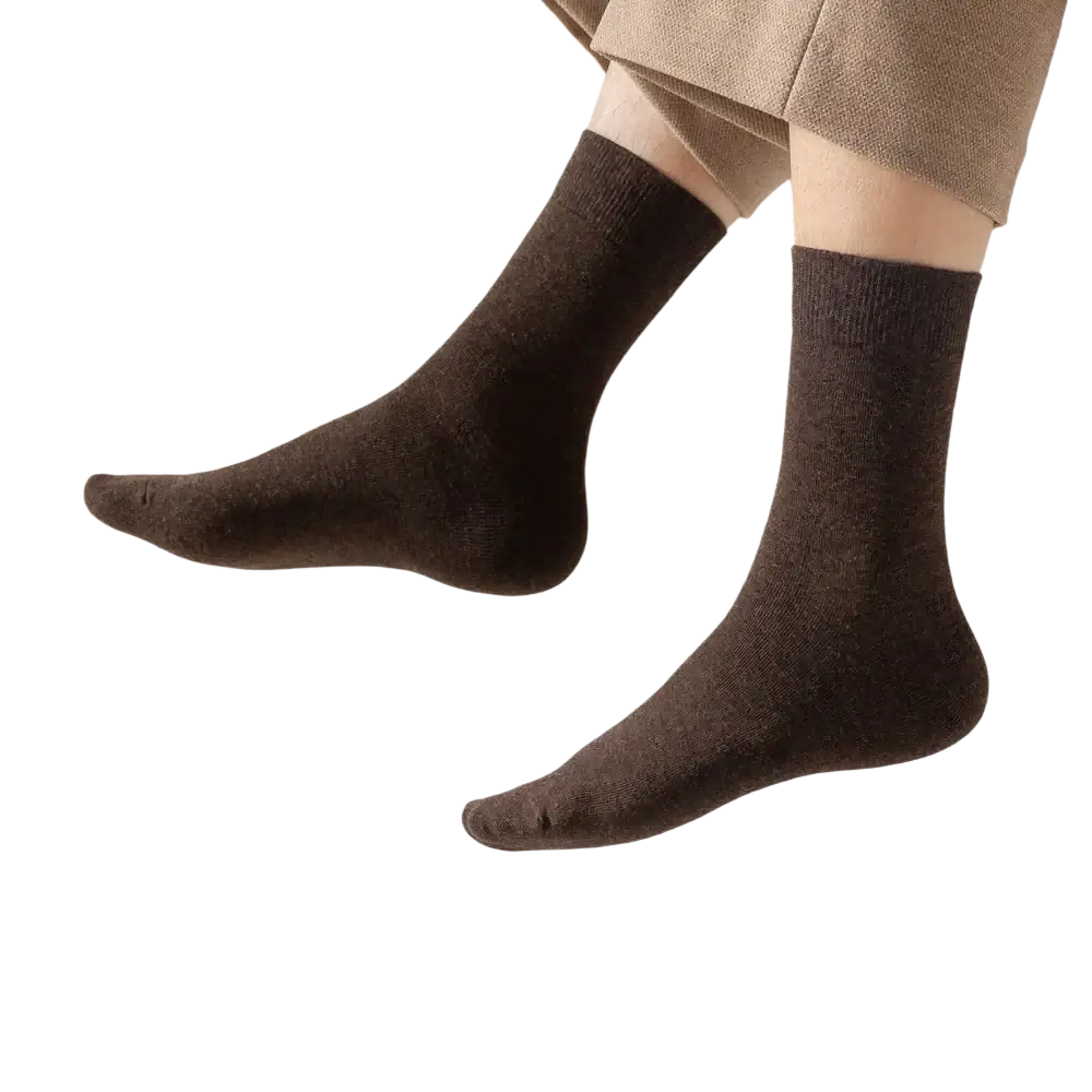 Men’s cotton casual ankle socks in dark brown with soft texture worn with beige trousers