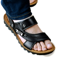 Men’s black cowhide leather sandals with textured sole and silver-toned buckle accents