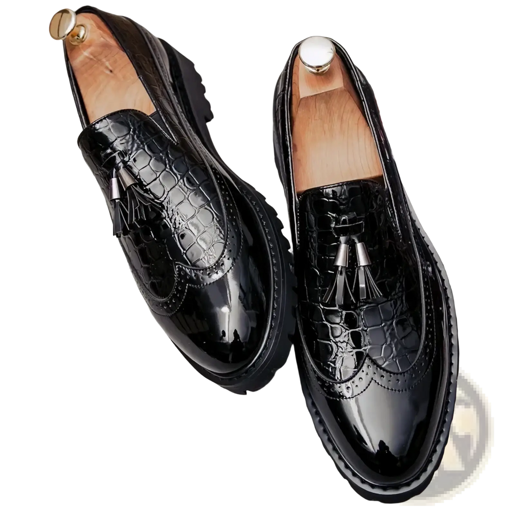 Men’s black croc embossed patent leather loafers with tassel details showcasing luxury and style