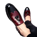 Men’s croc embossed leather tassel loafer in black and burgundy with crocodile texture and thick rubber sole
