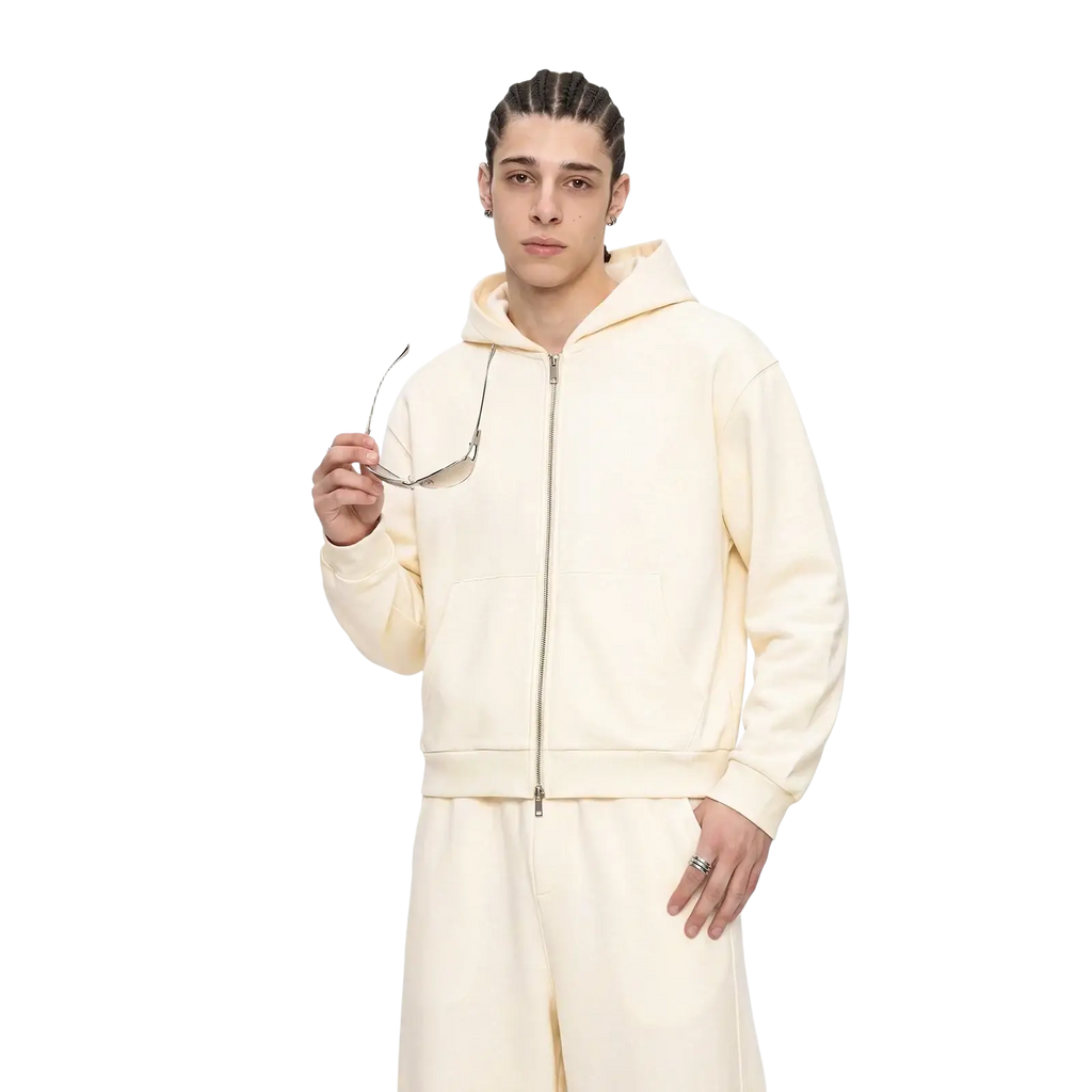 Men’s cropped cream-colored zip-up hoodie in brushed cotton with soft fabric, matching drawstring hood, and classic sleeve style