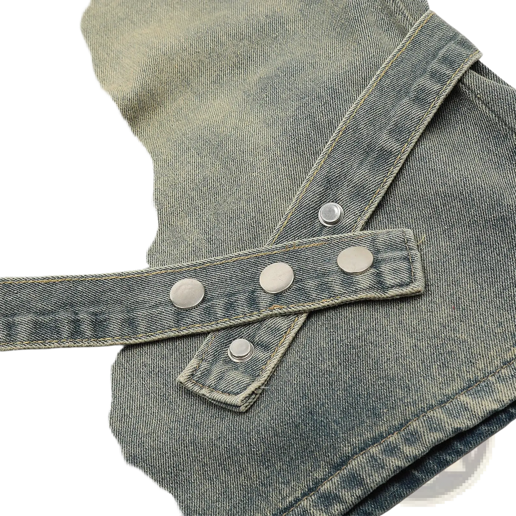 Men’s faded denim shorts with diagonal cross-over strap detail and four silver-toned snap buttons front closure