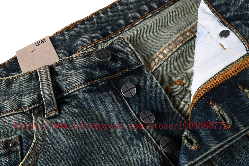Men’s distressed blue acid wash denim shorts featuring dark-wash denim with brown stitching and black button closures