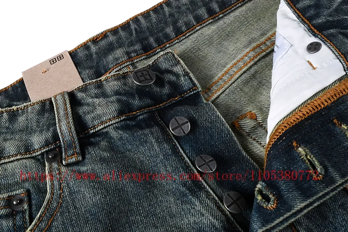 Men’s distressed blue acid wash denim shorts featuring dark-wash denim with brown stitching and black button closures