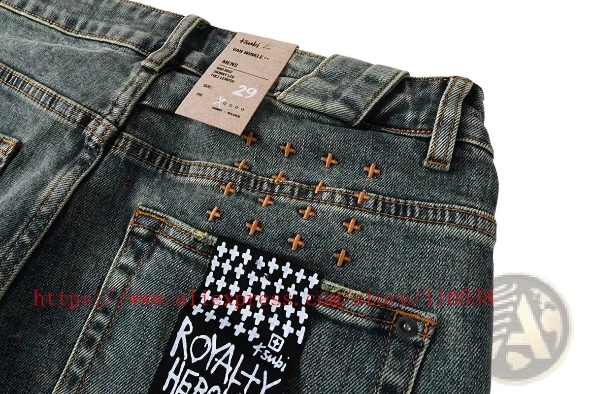 Back side of men’s distressed blue acid wash denim shorts with dark-wash jeans style houndstooth patch and orange studs