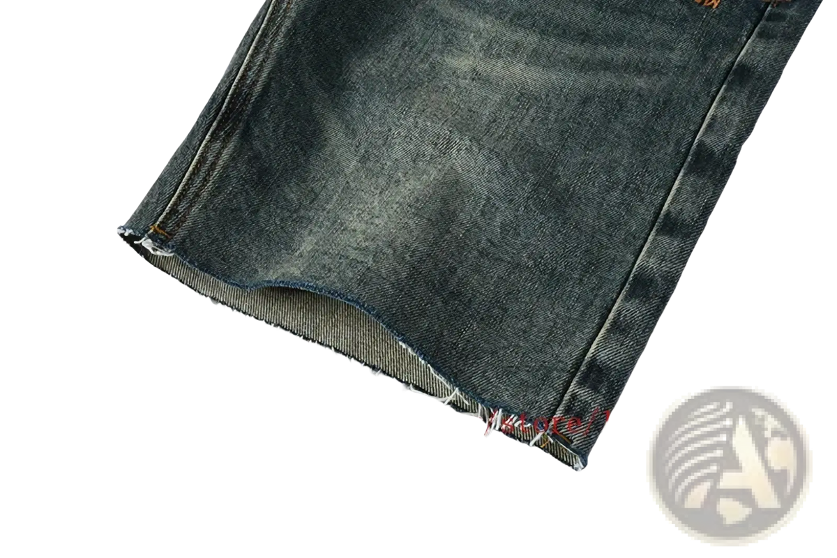 Men’s distressed blue acid wash denim shorts with dark-wash fabric, frayed hem, and visible stitching
