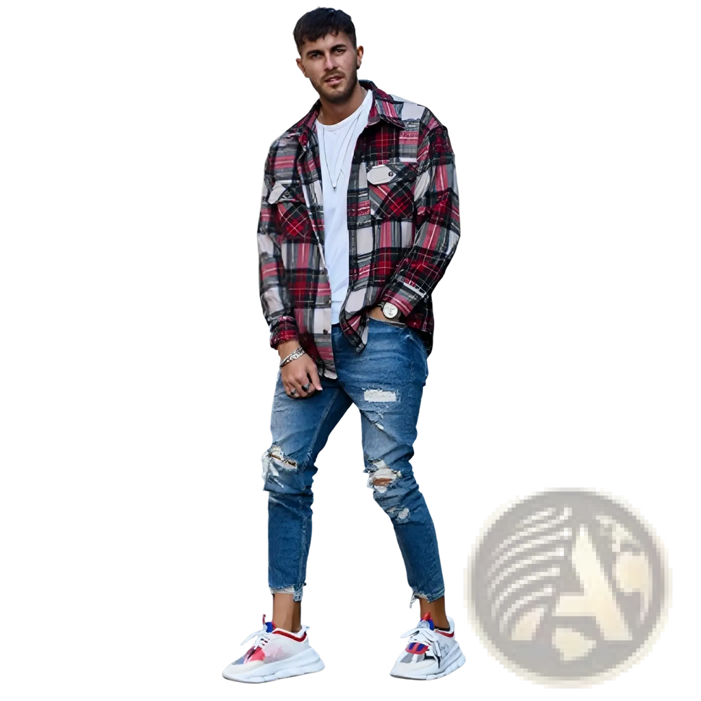 Man wearing men’s distressed blue denim ripped knee jeans paired with a red and black plaid flannel shirt