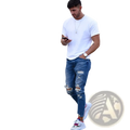 Men’s distressed blue denim ripped knee jeans paired with a white short sleeve crew neck t-shirt worn casually