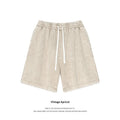 Beige distressed cotton mens shorts with vintage snowflake pattern and white drawstrings for summer apparel