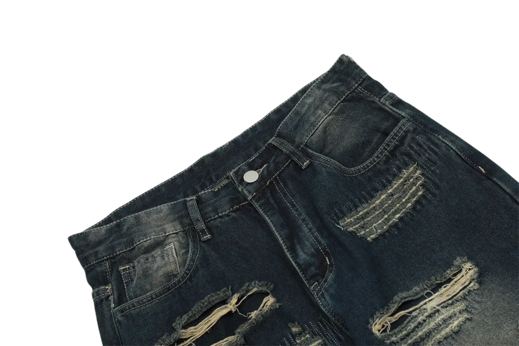 Men’s distressed dark wash straight leg ripped jeans with frayed edges and visible stitching in denim material
