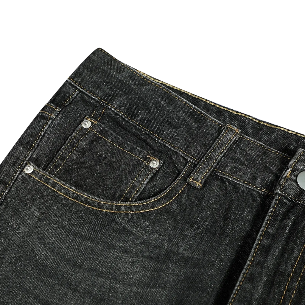 Men’s distressed flare leg dark wash denim jeans with contrasting light yellow stitching and silver metal rivets