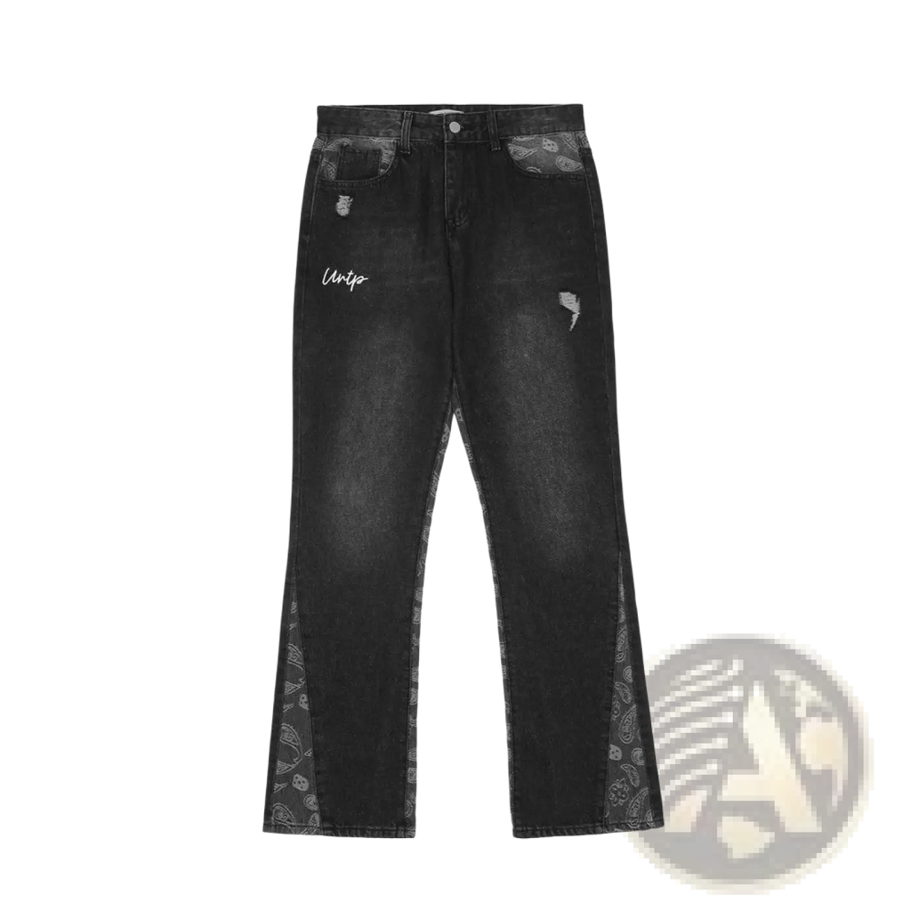 Men’s black denim distressed paisley patchwork flare jeans with bandana side panels and white uniq logo on the thigh