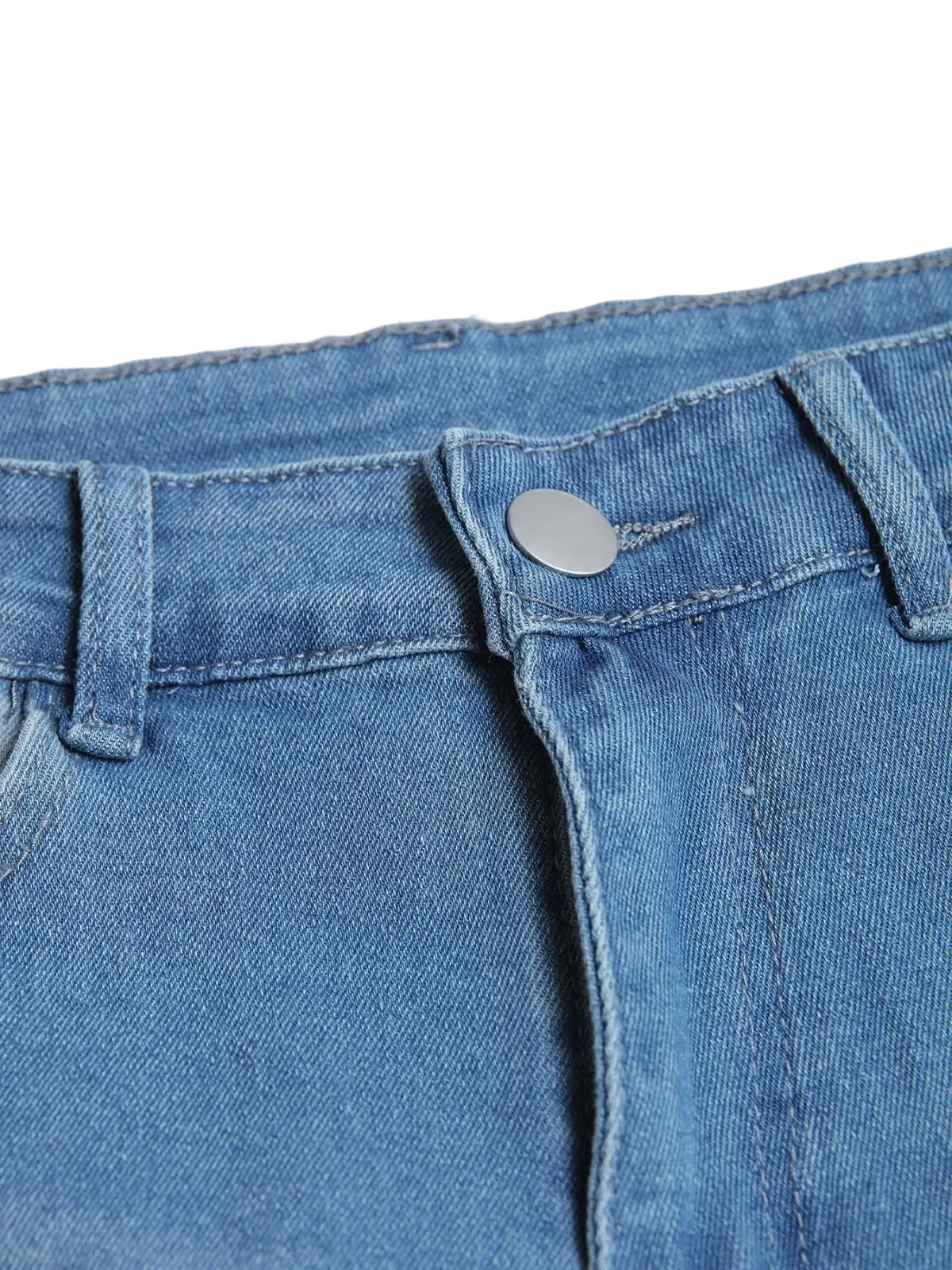 Men’s distressed slim fit stretch denim jeans in medium-wash blue with a silver button at the waistband