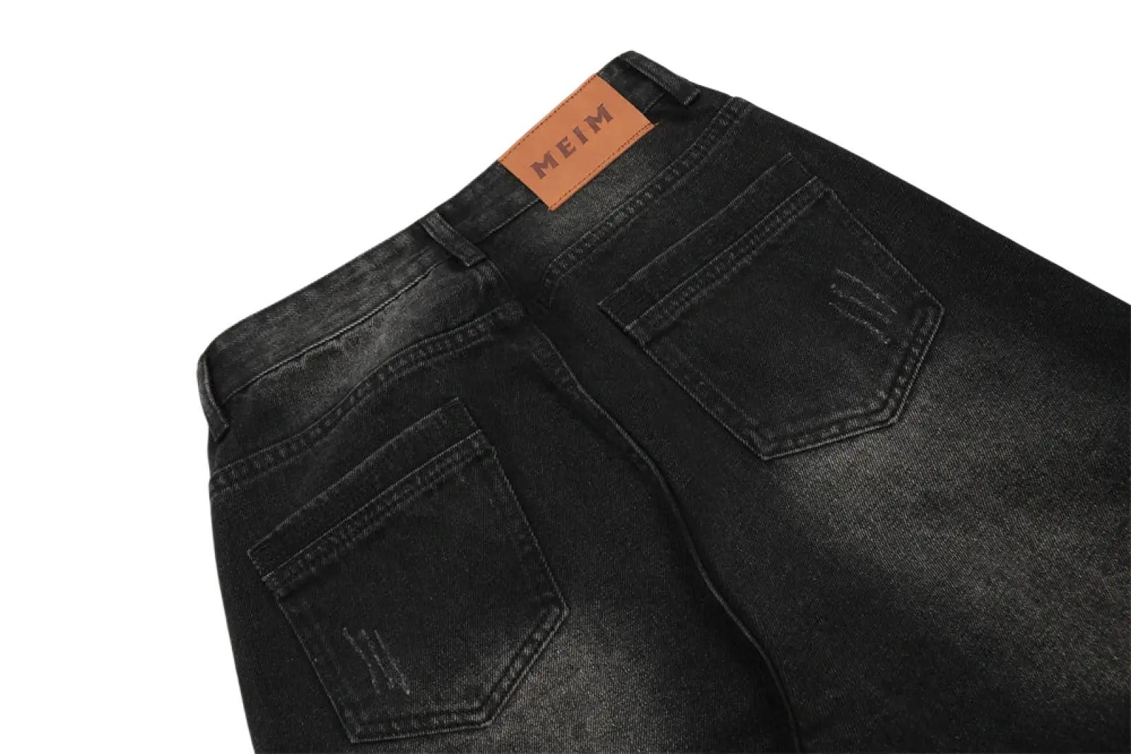 Black denim men’s distressed straight leg jeans with brown leather meim brand tag on the waistband back view
