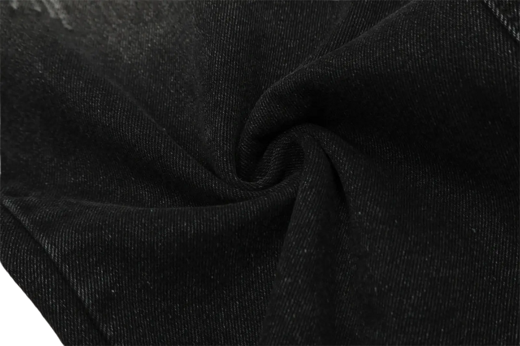 Men’s distressed straight leg black denim jeans fabric showing textured slightly worn black denim material