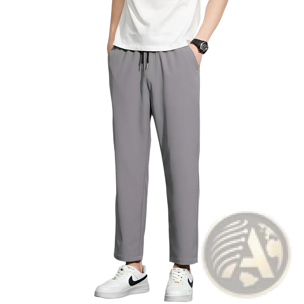 Mens drawstring casual trousers in gray slim-fit fabric with a drawstring waist and subtle side seam detailing