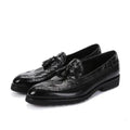 Men’s black crocodile embossed leather tassel brogue shoes combining luxury texture with classic loafer design