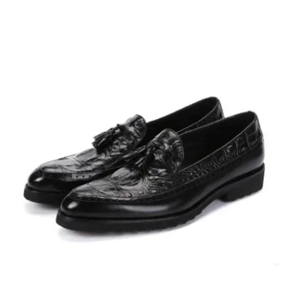 Men’s black crocodile embossed leather tassel brogue shoes combining luxury texture with classic loafer design